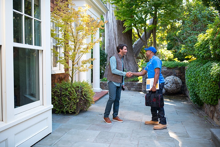 reliable handyman from Handyman Connection meeting with a customer