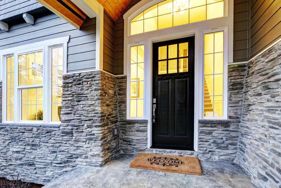 https://handymanconnection.com/wp-content/uploads/2021/05/bigstock-Front-Covered-Porch-Design-Wit-212155600.jpg