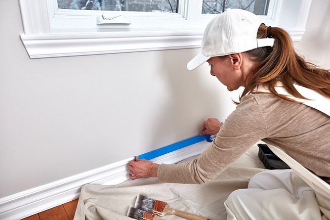 https://handymanconnection.com/wp-content/uploads/2021/05/bigstock-Woman-painting-wall-187596748.jpg