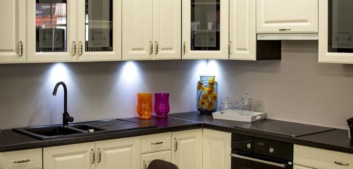 Kitchen With White Trim and Cool, Round Under-Cabinet Lighting